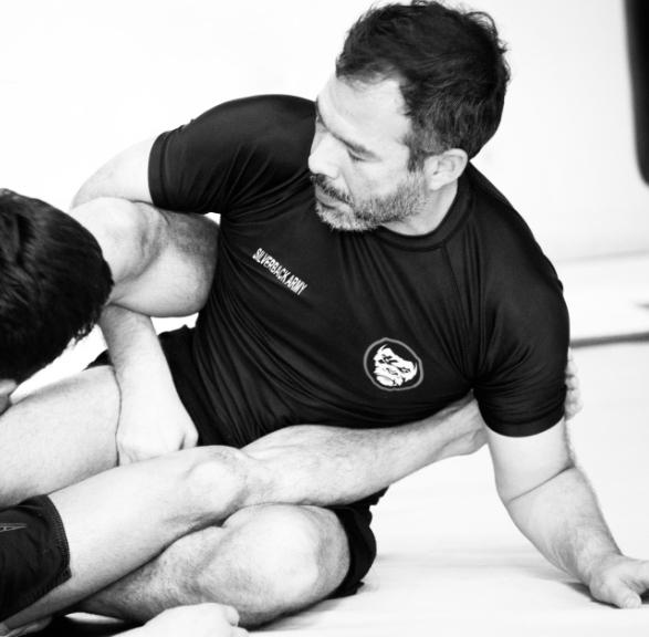 Coach Mario controlling an opponent's leg during NoGi training