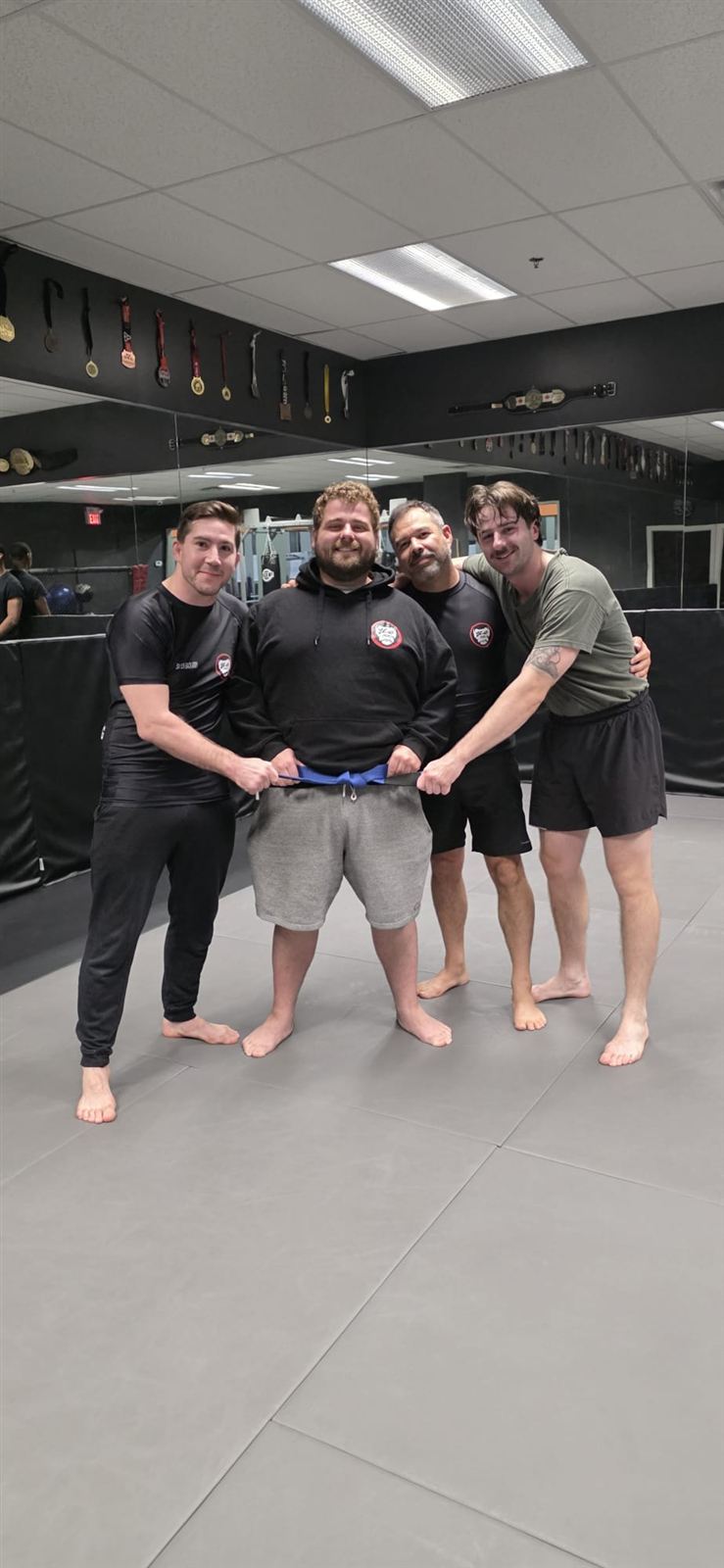 A Silverback student receiving his blue belt